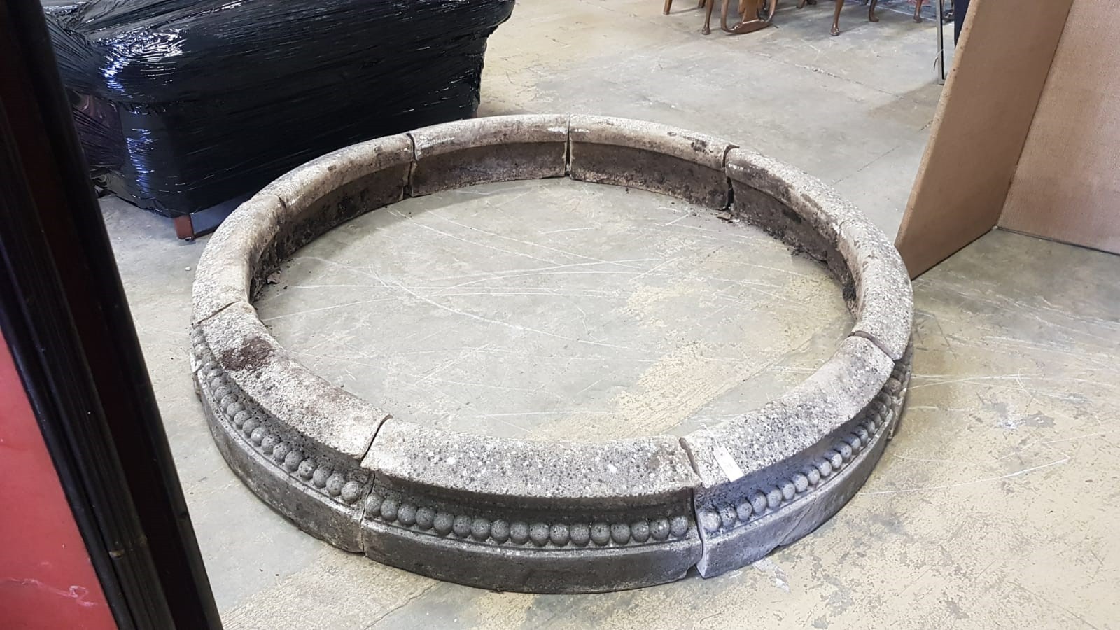 A reconstituted stone circular sectional garden planter, each segment width 68cm, height 28cm